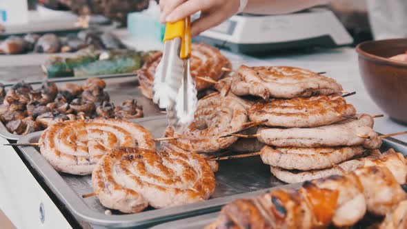 Ready-to-Eat Grilled Meat in a Street Food Shop Window. Ready-made Food on Party