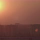 Time Lapse Shot of the Sunset The Sun Hides Behind the Buildings - VideoHive Item for Sale