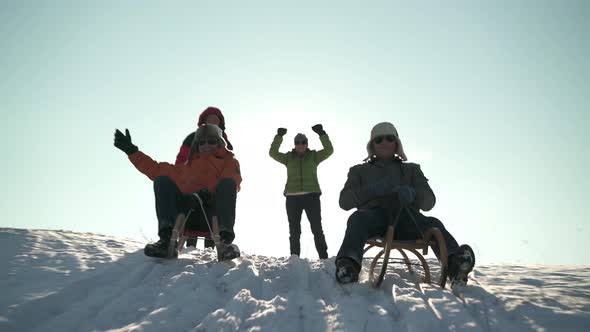 Happy Senior Men With Winter Caps Tobogganing