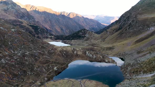 Lake Saussat and Lac d'Espingo mountain lakes located in Haute-Garonne, France, Aerial fly