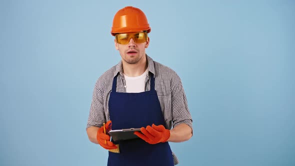 Man in Safety Wear Hard Hat Protective Goggles Gloves