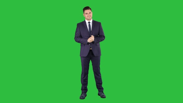 Handsome businessman counting euros on a Green Screen, Chroma Key.