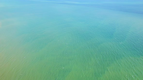 4K Aerial view of drone move on beautiful sea. Flight over ocean, open sea.