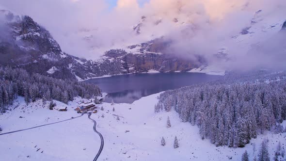 Oeschinen Lake in the Snowy Mountains of Switzerland on a Foggy Morning