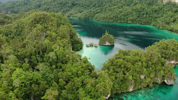 Aerial View Of Triton Bay With Turquoise Sea And Green Tropical Trees In Kaimana Islands