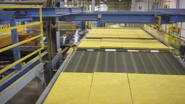 Cut Slabs of Mineral Wool Moving on Automated Production Line