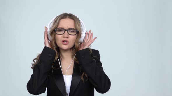 Woman Dancing Enjoy Music in Big White Earphones, Slow Motion