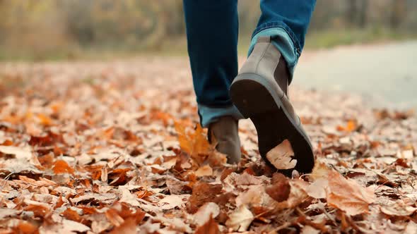 Stylish Man Legs In Leather Shoes Walking On Vacation Holiday In Cold Autumn Day.