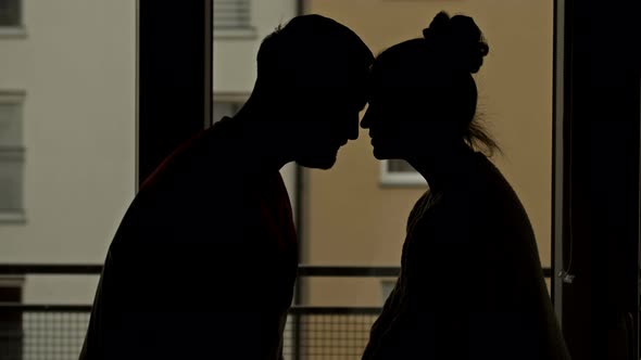 Loving Couple Kissing Window Background Overlooking Nigth City