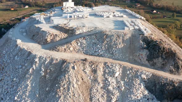 Carrara white marble quarry - construction rocks mining in an open-pit mine in Tuscany, Italy.