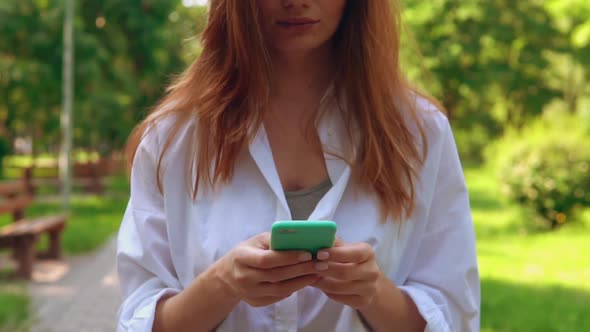  Woman Hands with Mobile on the Street