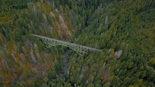 Aerial orbit of abandoned Vance Creek Bridge in the pacific northwest state of Washington.