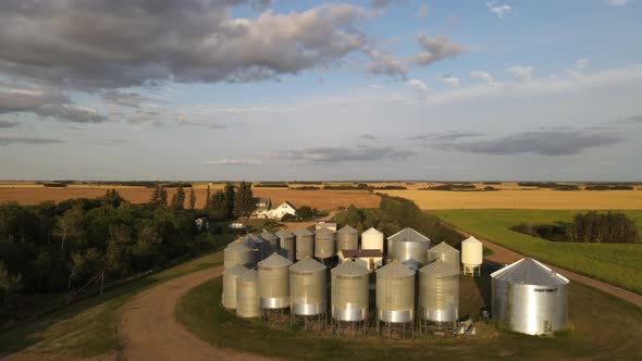 Aerial forwarding drone footage high above a small family operated grain farm in American prairie du