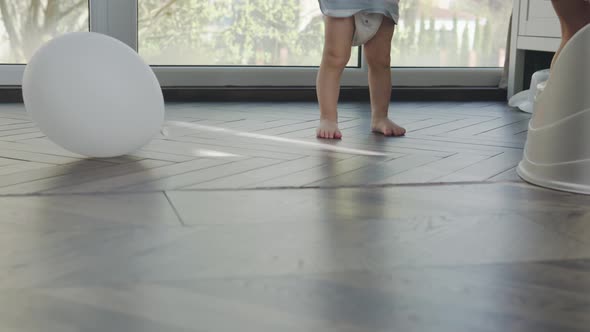 Unrecognizable Barefoot Children Playing at Home Together Happy Siblings Running