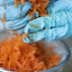 Woman Wring Out Grated Carrots for Cooking - VideoHive Item for Sale