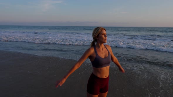 Attractive Woman Working Out At The Beach