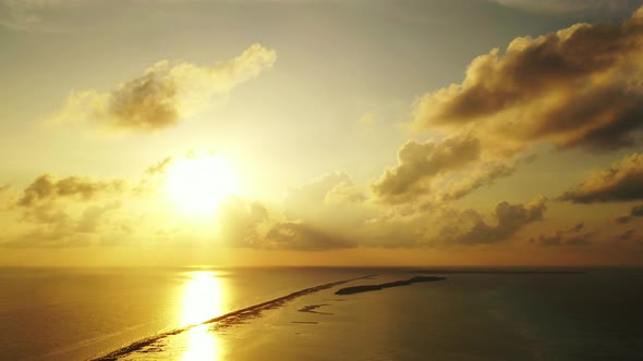 Tropical aerial clean view of a sunshine white sandy paradise beach and blue water background in col