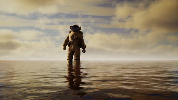 Spaceman in the Sea Under Clouds at Sunset