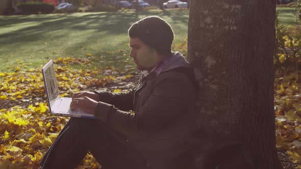 College student on campus using laptop computer