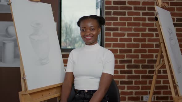 Portrait of African American Woman Learning to Draw Vase Design