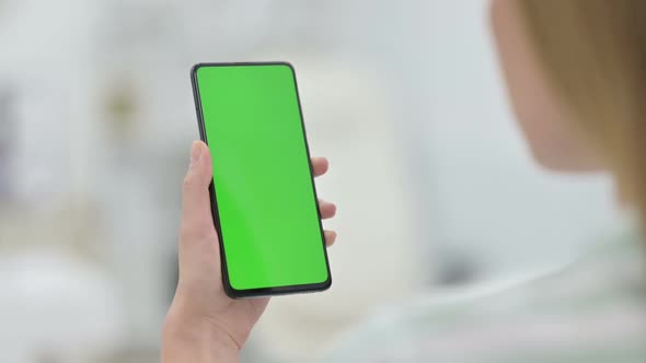 Woman Using Smartphone with Green Key Chroma Screen