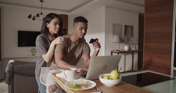 Diverse Couple Making Online Order