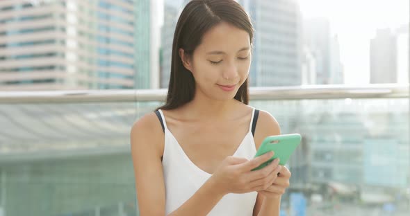 Woman use of phone at outdoor 