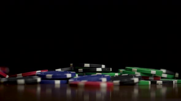 Falling Poker Chips Isolated On Black Background