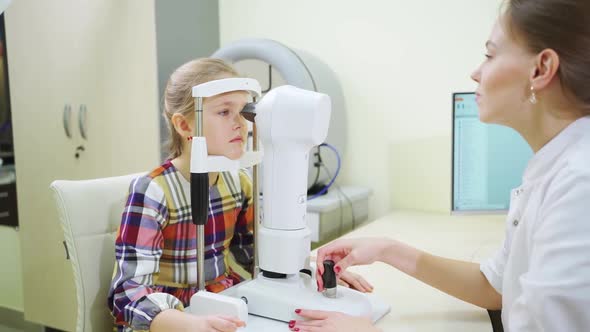 Ophthalmologist Examines the Girl on a Corneo Topographer