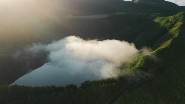 Beautiful Sunrise Over the Lake in Crater with Dense Steam