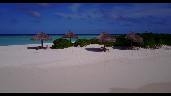 Aerial top down scenery of exotic seashore beach vacation by transparent water with white sand backg