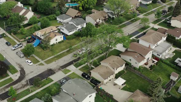 Aerial Top Drone View of Road Repairs in the Suburbs on the Street with Many Houses