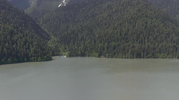 Shooting From Helicopter Flying Over Amazing Natural Landscape with Lake High Mountains Snowy Tops