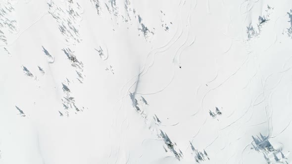 Skier skiing on a snow capped mountain 4k