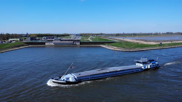 Inland Barge Vessel With Cover Cruising At Noord River Near Hendrik-Ido-Ambacht, Netherlands. - aeri