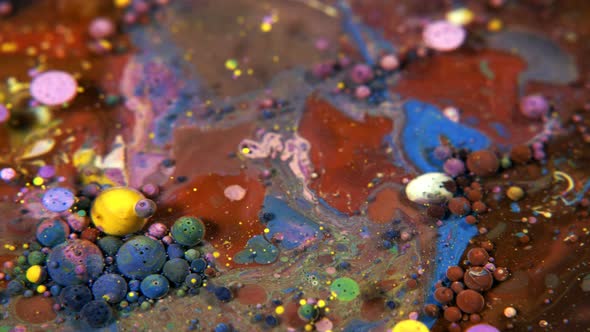Abstract Colorful Acrylic And Food Paint Bubbles On Water alt