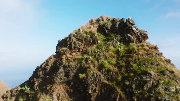 Drone Soaring Low Above High Mountain Peak Revealing Breathtaking Epic Kauai