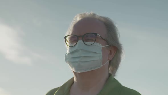 Close up of man with mask-wearing glasses