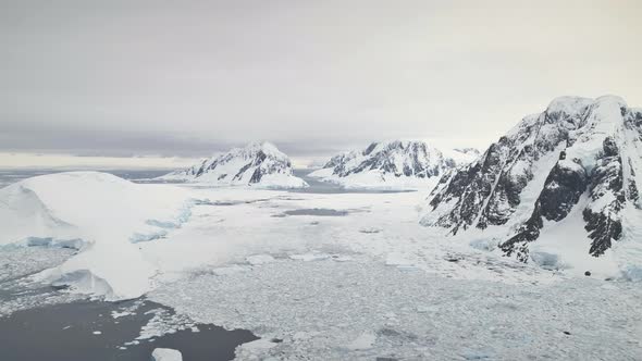 Aerial Flight Over Antarctica Mountains, Ocean.