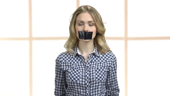 Woman Protester with Taped Mouth