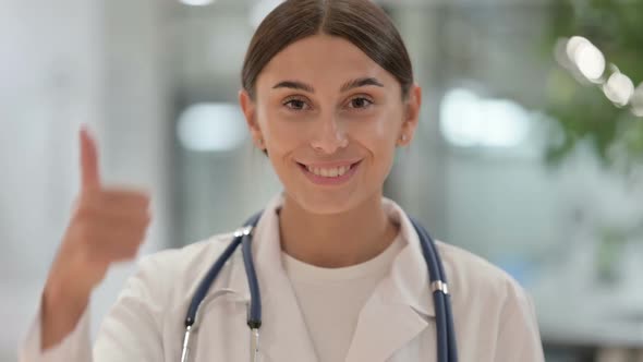 Portrait of Female Doctor Showing Thumbs Up Sign