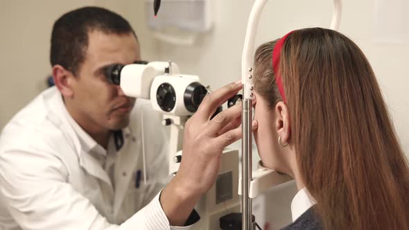 Doctor Examining Patient's Eyes