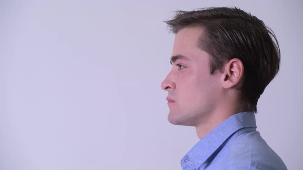 Profile View of Young Handsome Businessman Thinking