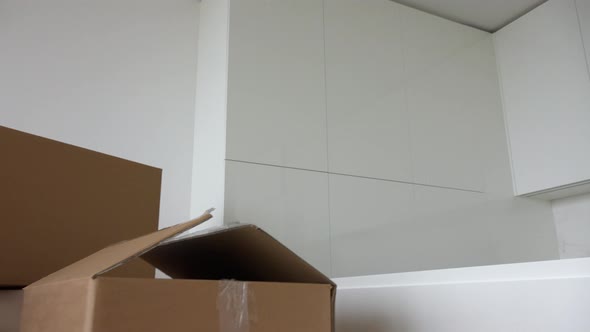 Cardboard Boxes and Chairs in the Interior of an Apartment - Closeup