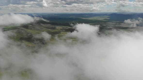 Central Asian Steppes Through Clouds