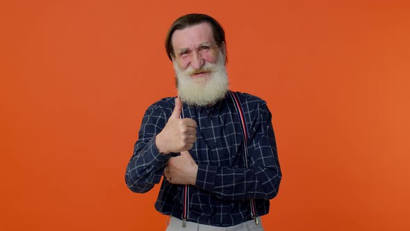 Senior Old Bearded Man Raises Thumbs Up Agrees with Something or Gives Positive Reply Likes Good