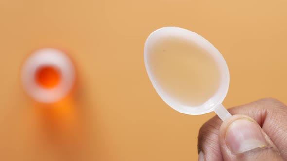 Liquid Medicine on a Plastic Spoon