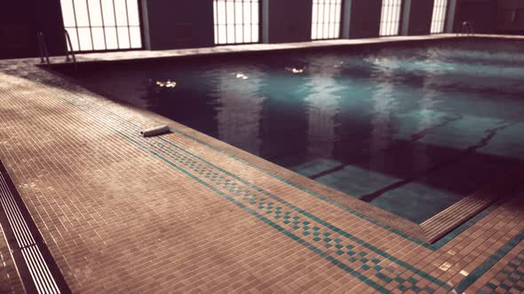 The View of an Empty Public Swimming Pool Indoors alt