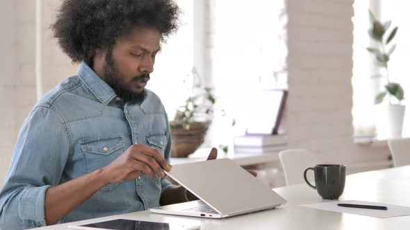 Creative African Man Leaving Office After Working On Laptop