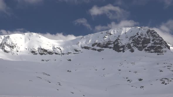 High Altitude Rocky Snowy Mountain Ridge in Terrestrial Winter Climate